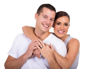 beautiful married couple embracing on white background